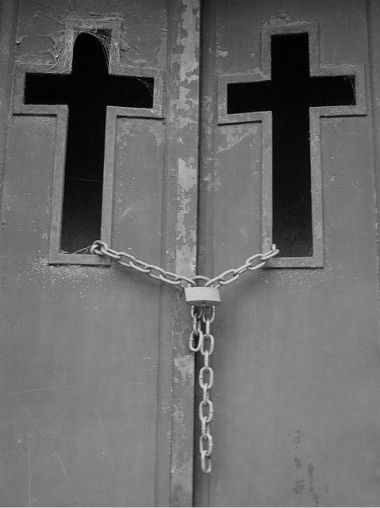 Cross on door and chains